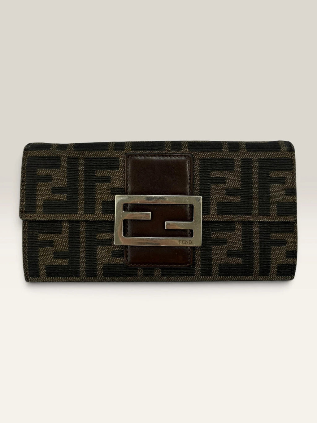 Fendi brown long wallet with Zucca FF monogram canvas and oversized logo buckle.