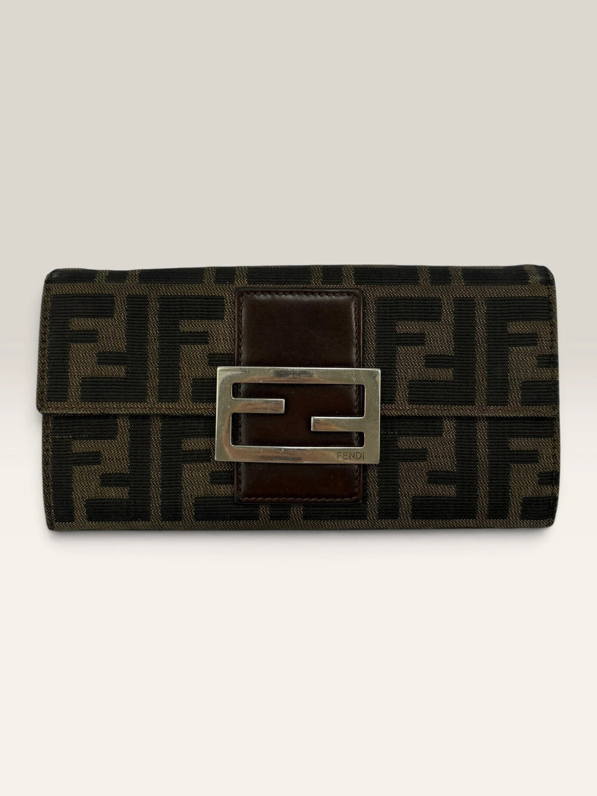 Fendi brown long wallet with Zucca FF monogram canvas and oversized logo buckle.