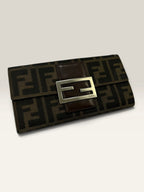 Fendi brown long wallet with Zucca FF monogram canvas and oversized logo buckle.