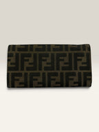 Fendi brown long wallet with Zucca FF monogram canvas and oversized logo buckle.