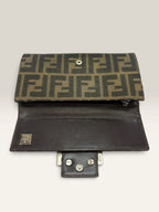 Fendi brown long wallet with Zucca FF monogram canvas and oversized logo buckle.