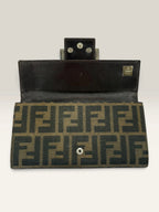 Fendi brown long wallet with Zucca FF monogram canvas and oversized logo buckle.