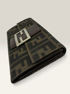 Fendi brown long wallet with Zucca FF monogram canvas and oversized logo buckle.