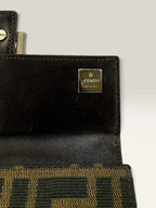 Fendi brown long wallet with Zucca FF monogram canvas and oversized logo buckle.