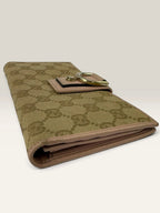 Gucci beige pink long wallet GG canvas with gold-tone Horsebit clasp and leather trim.