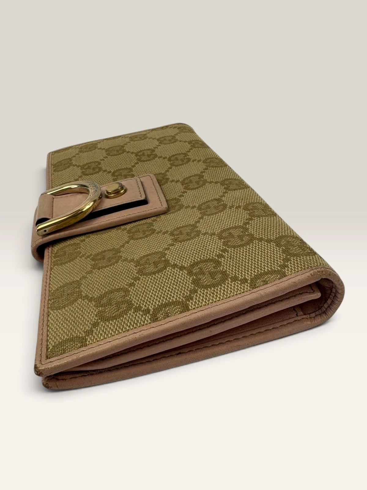 Gucci beige pink long wallet GG canvas with gold-tone Horsebit clasp and leather trim.