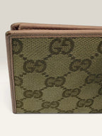 Gucci beige pink long wallet GG canvas with gold-tone Horsebit clasp and leather trim.