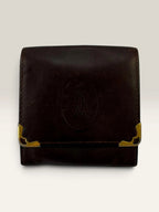 Cartier burgundy leather coin purse embossed logo with gold-tone corner hardware.