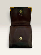 Cartier burgundy leather coin purse embossed logo with gold-tone corner hardware.