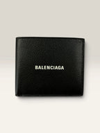Balenciaga black bifold wallet grained leather with white cash logo print.