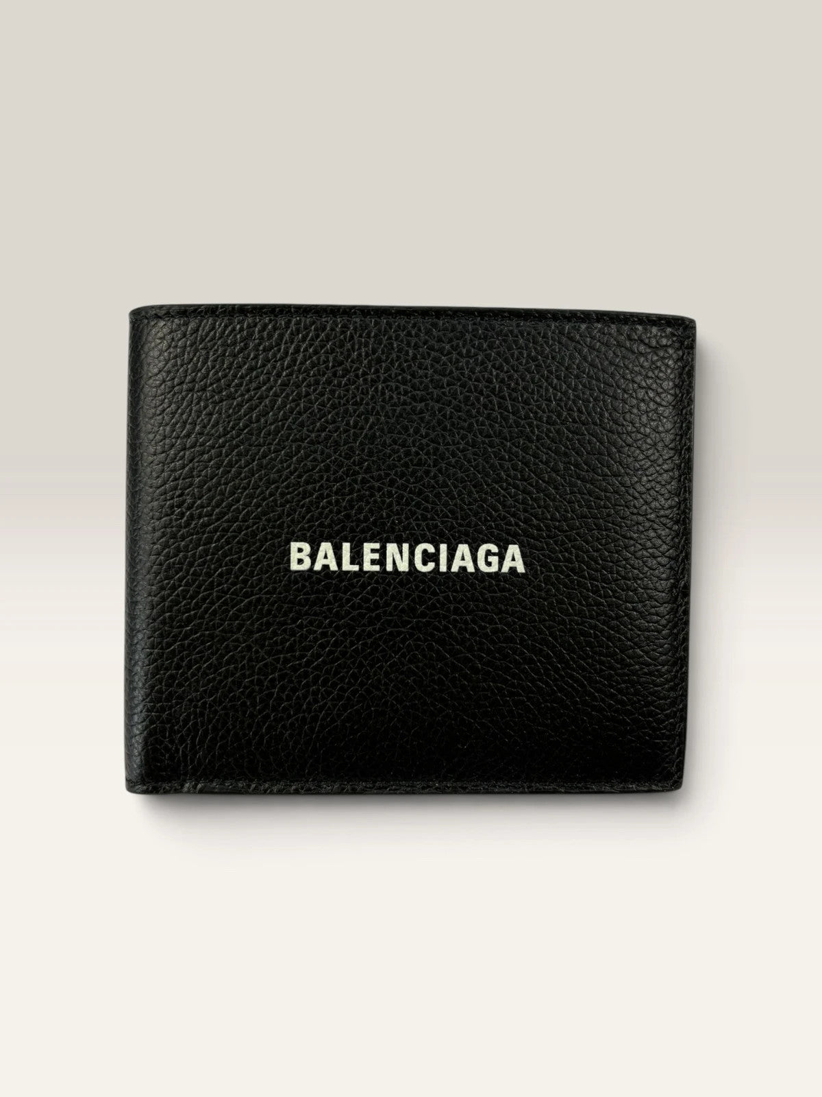 Balenciaga black bifold wallet grained leather with white cash logo print.