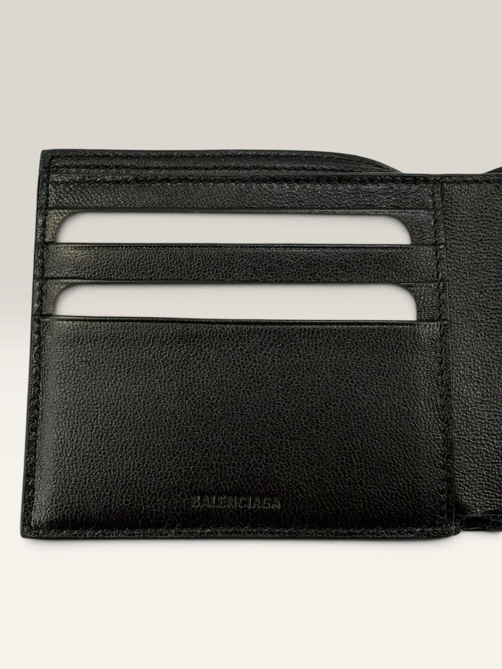 Balenciaga black bifold wallet grained leather with white cash logo print.