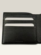 Balenciaga black bifold wallet grained leather with white cash logo print.