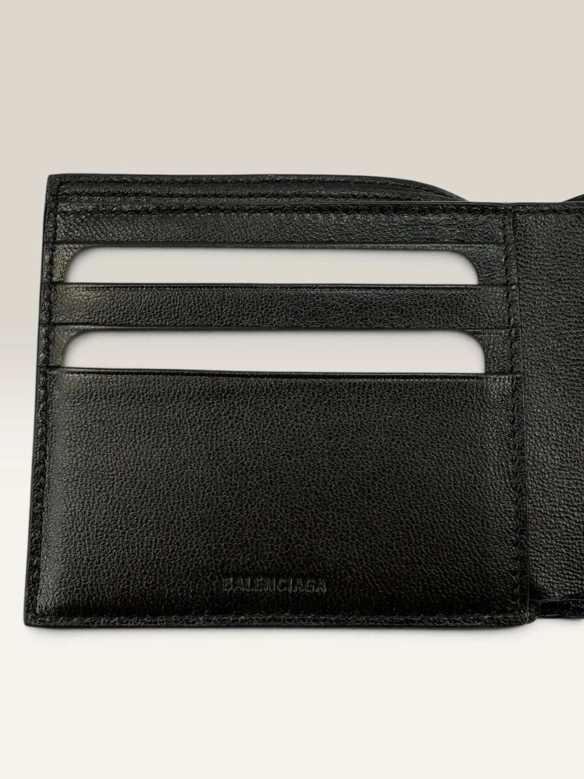 Balenciaga black bifold wallet grained leather with white cash logo print.