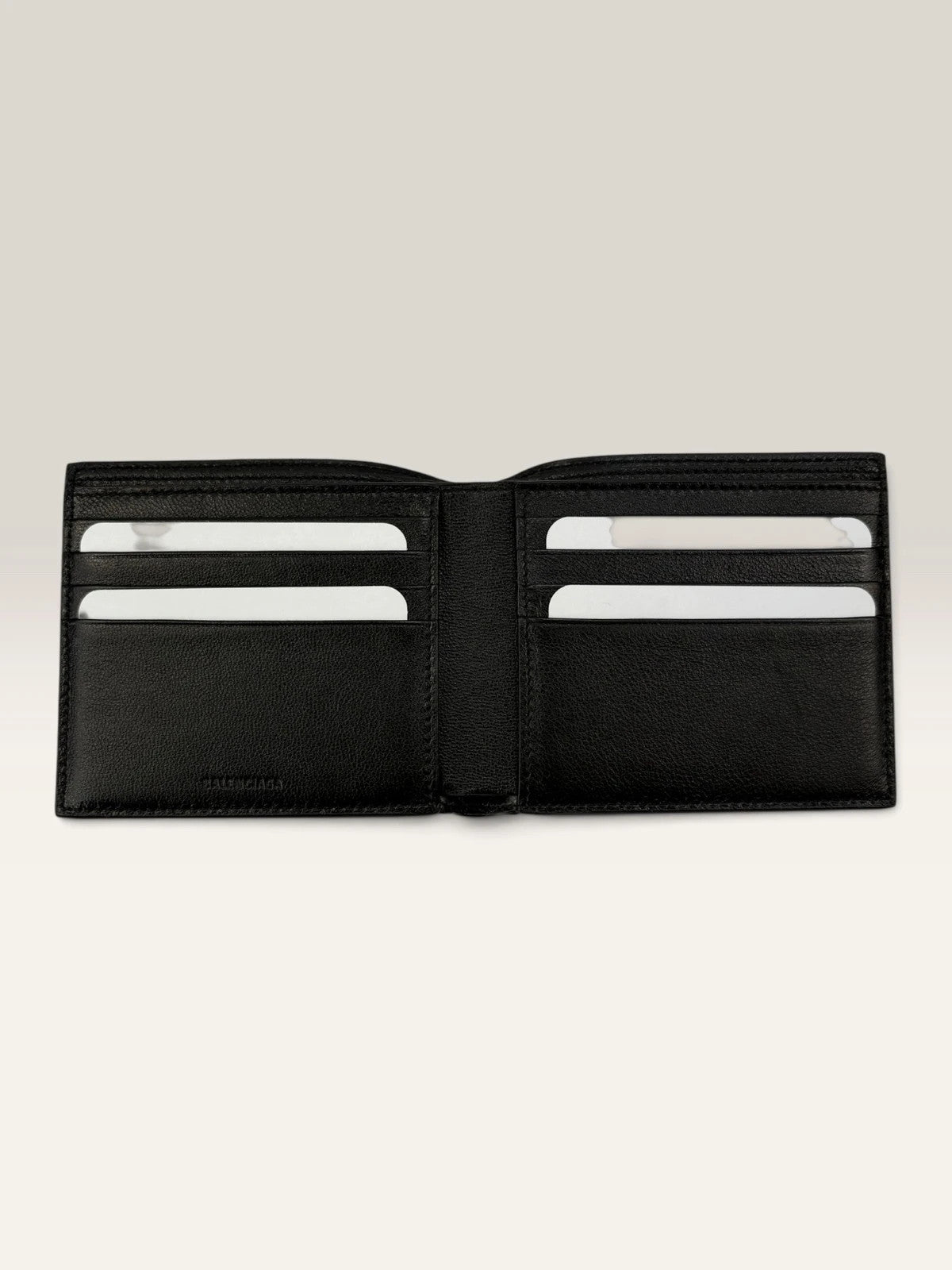 Balenciaga black bifold wallet grained leather with white cash logo print.