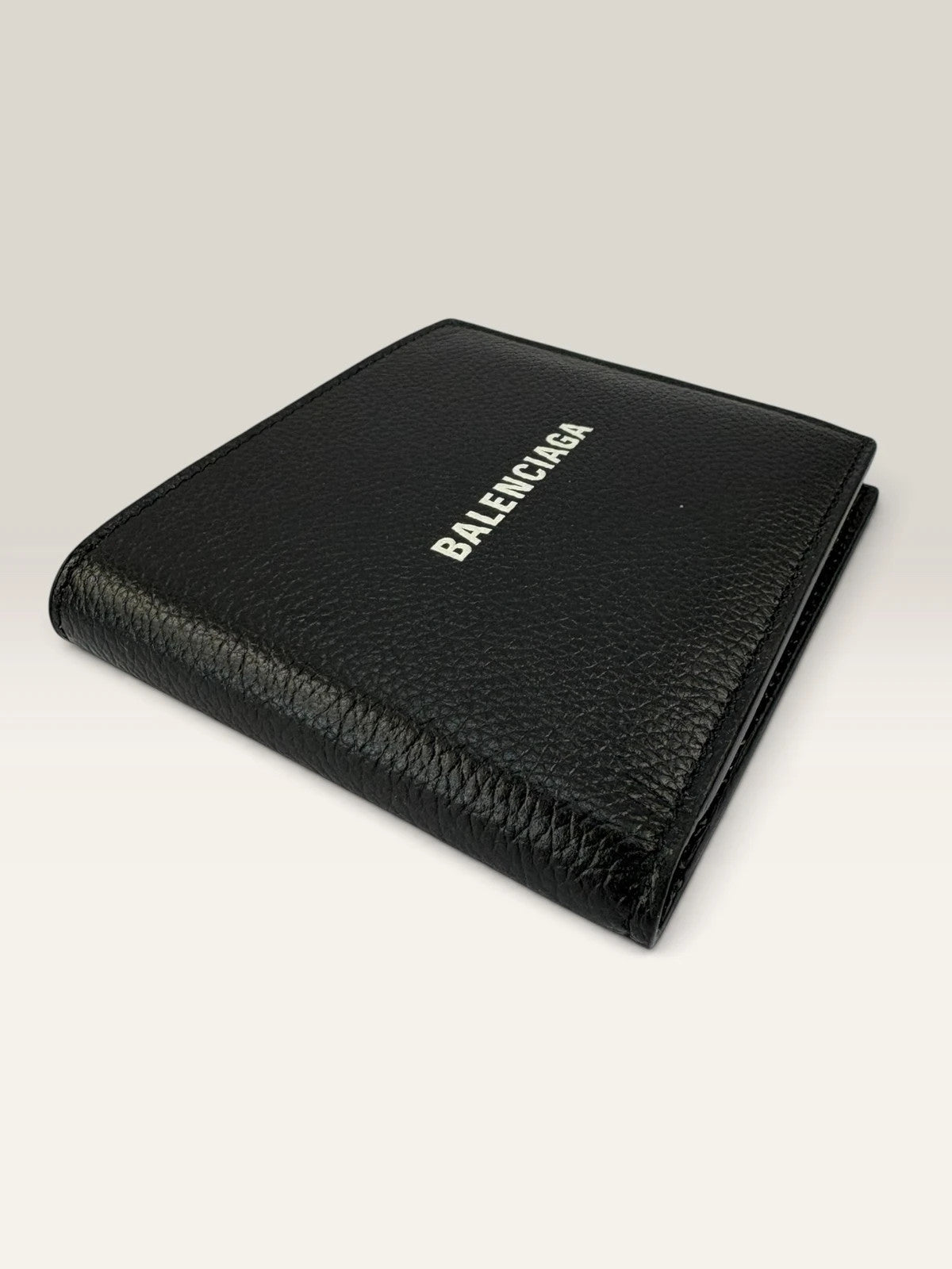 Balenciaga black bifold wallet grained leather with white cash logo print.