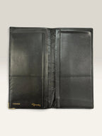 Givenchy black leather wallet embossed 4G logo, smooth texture, vintage condition.