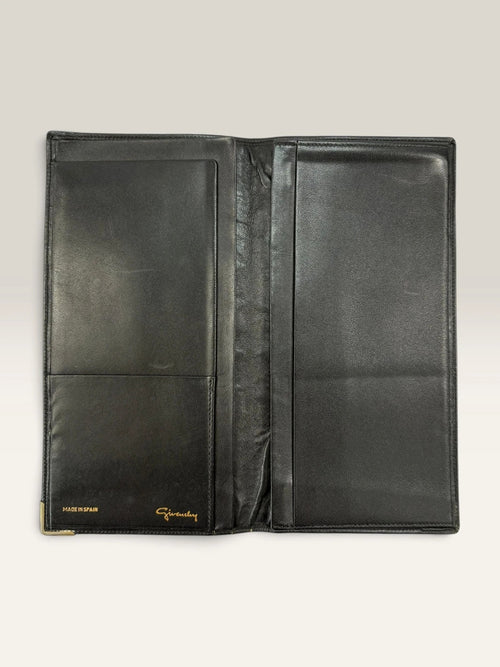 Givenchy black leather wallet embossed 4G logo, smooth texture, vintage condition.
