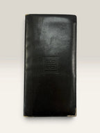 Givenchy black leather wallet embossed 4G logo, smooth texture, vintage condition.