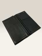 Givenchy black leather wallet embossed 4G logo, smooth texture, vintage condition.