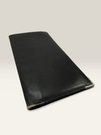 Givenchy black leather wallet embossed 4G logo, smooth texture, vintage condition.