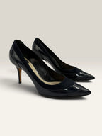 Dior navy blue stiletto heels in suede and patent leather with pointed toe design.