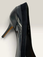 Dior navy blue stiletto heels in suede and patent leather with pointed toe design.