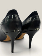 Dior navy blue stiletto heels in suede and patent leather with pointed toe design.