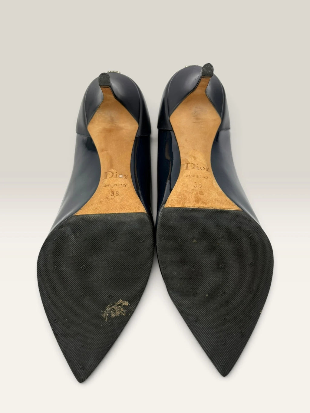 Dior navy blue stiletto heels in suede and patent leather with pointed toe design.