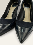 Dior navy blue stiletto heels in suede and patent leather with pointed toe design.
