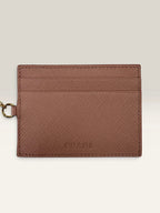 Prada pink leather wallet with structured bow detail and gold-tone hardware.