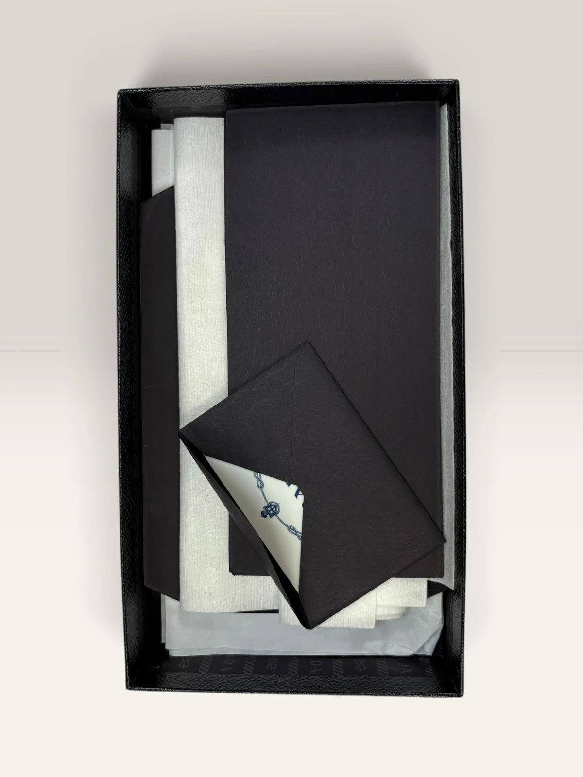 Prada pink leather wallet with structured bow detail and gold-tone hardware.