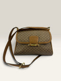 Gucci beige GG monogram canvas shoulder bag with brown leather trim and gold-tone hardware.