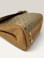 Gucci beige GG monogram canvas shoulder bag with brown leather trim and gold-tone hardware.