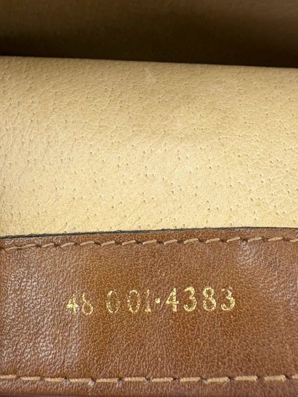 Gucci beige GG monogram canvas shoulder bag with brown leather trim and gold-tone hardware.
