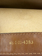 Gucci beige GG monogram canvas shoulder bag with brown leather trim and gold-tone hardware.