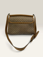 Gucci beige GG monogram canvas shoulder bag with brown leather trim and gold-tone hardware.