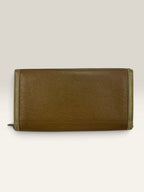 BVLGARI brown leather purse with orange accents and iconic hardware, showing vintage wear.