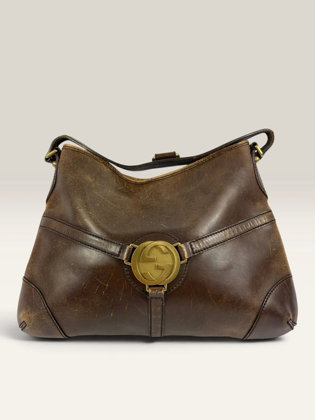 Gucci brown leather shoulder bag oversized interlocking GG logo gold hardware vintage patina