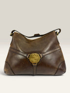 Gucci brown leather shoulder bag oversized interlocking GG logo gold hardware vintage patina