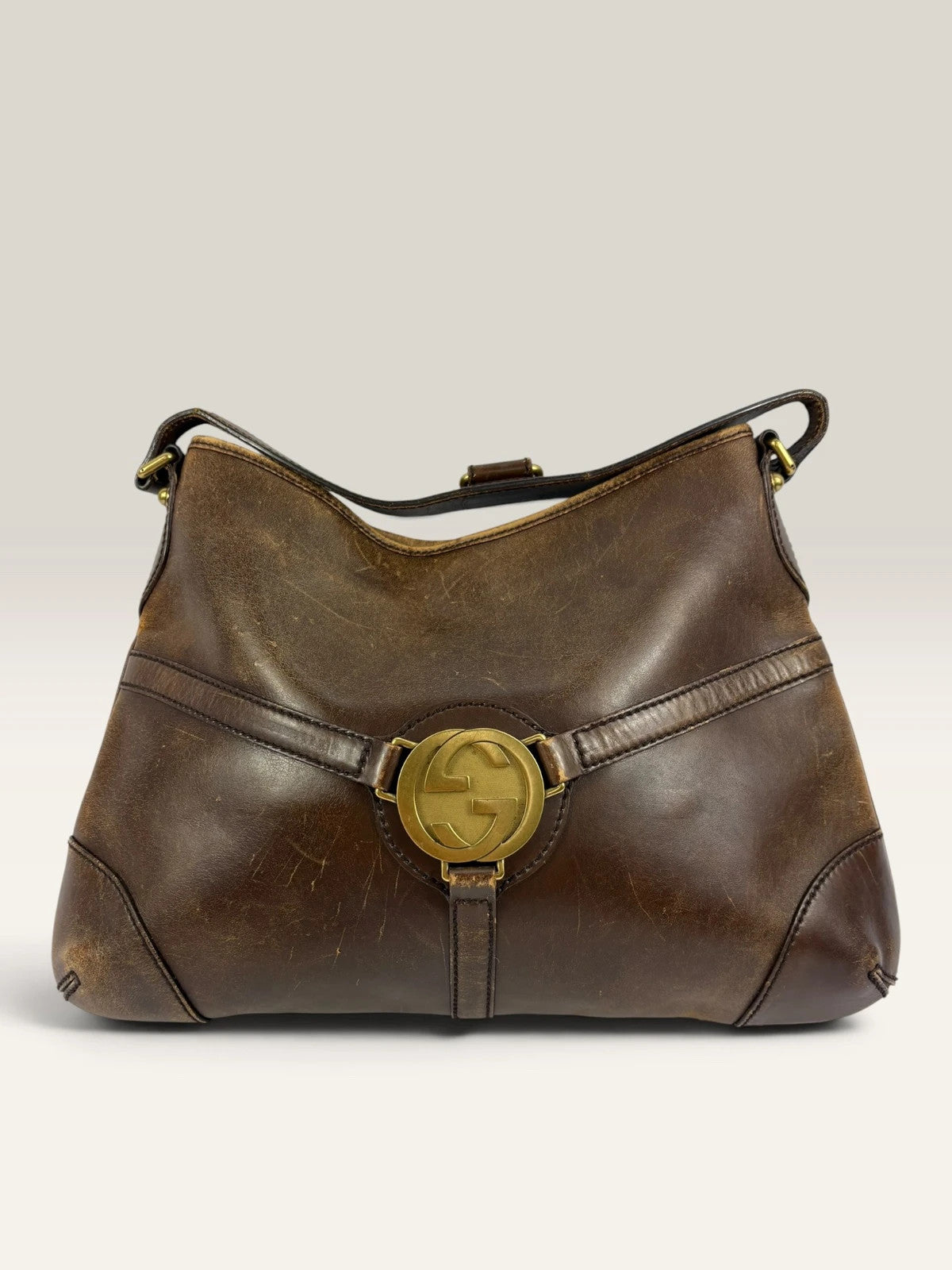 Gucci brown leather shoulder bag oversized interlocking GG logo gold hardware vintage patina