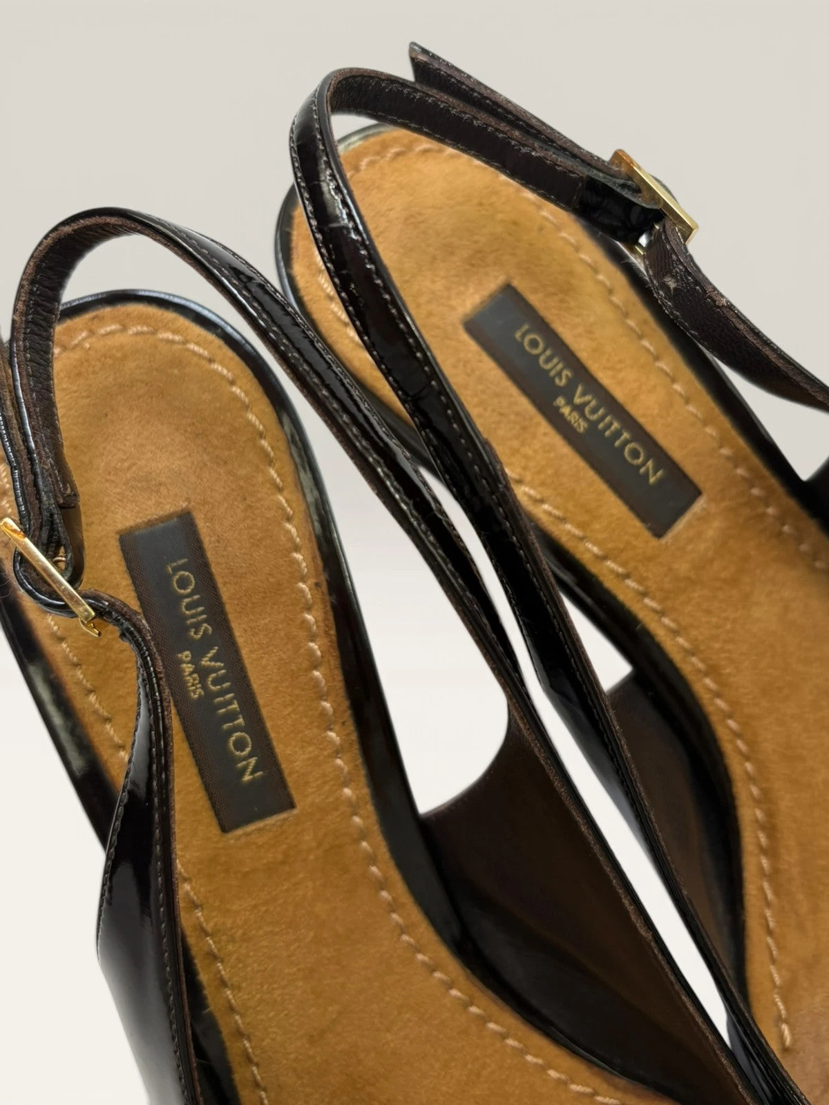 Louis Vuitton slingback heels black and brown patent leather with Damier checkerboard pattern.