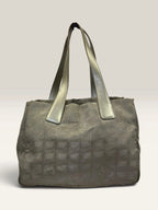 Chanel grey jacquard nylon tote with interlocking CC logo and leather shoulder straps.