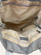 Chanel grey jacquard nylon tote with interlocking CC logo and leather shoulder straps.