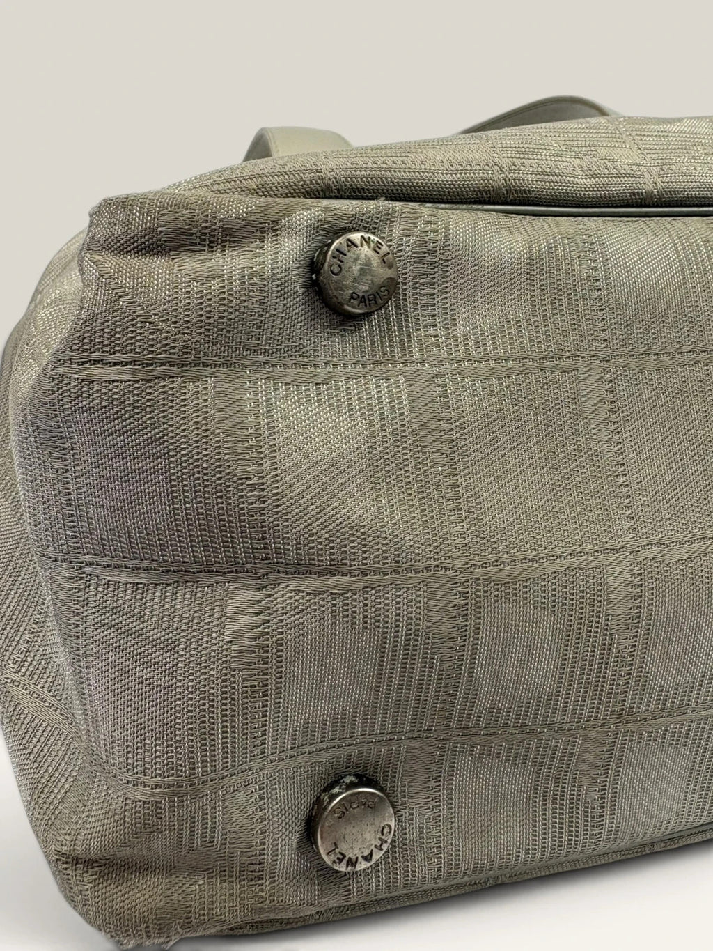 Chanel grey jacquard nylon tote with interlocking CC logo and leather shoulder straps.