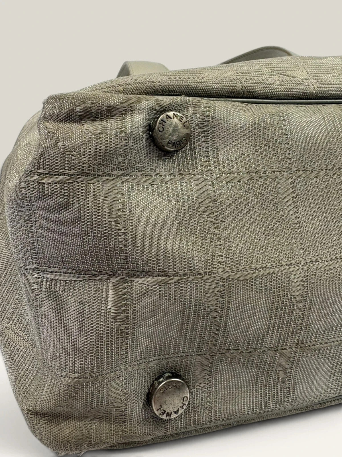 Chanel grey jacquard nylon tote with interlocking CC logo and leather shoulder straps.