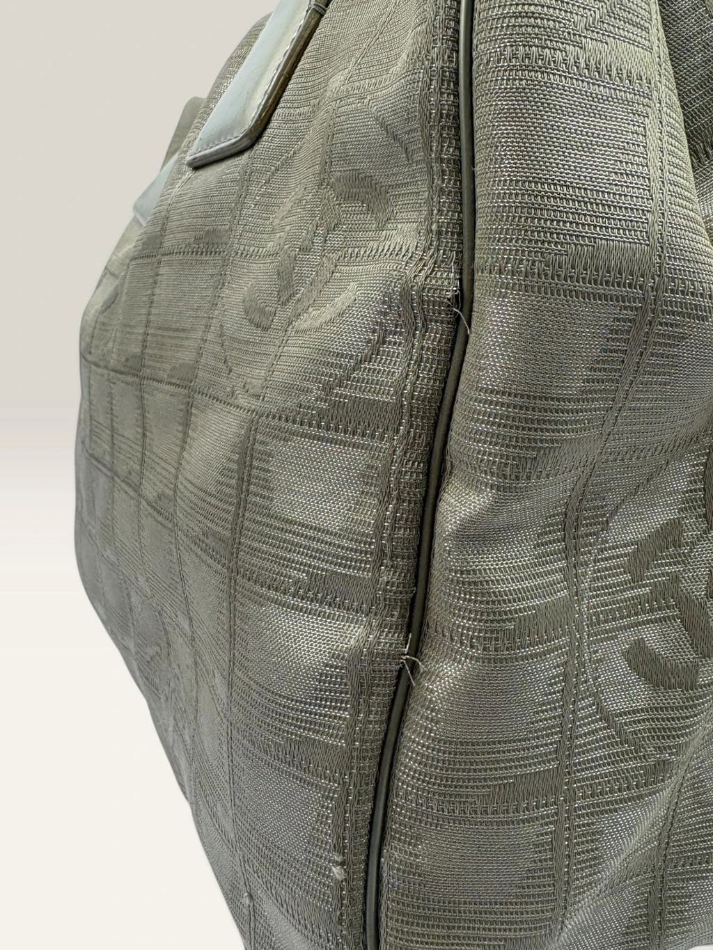 Chanel grey jacquard nylon tote with interlocking CC logo and leather shoulder straps.