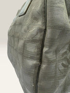 Chanel grey jacquard nylon tote with interlocking CC logo and leather shoulder straps.