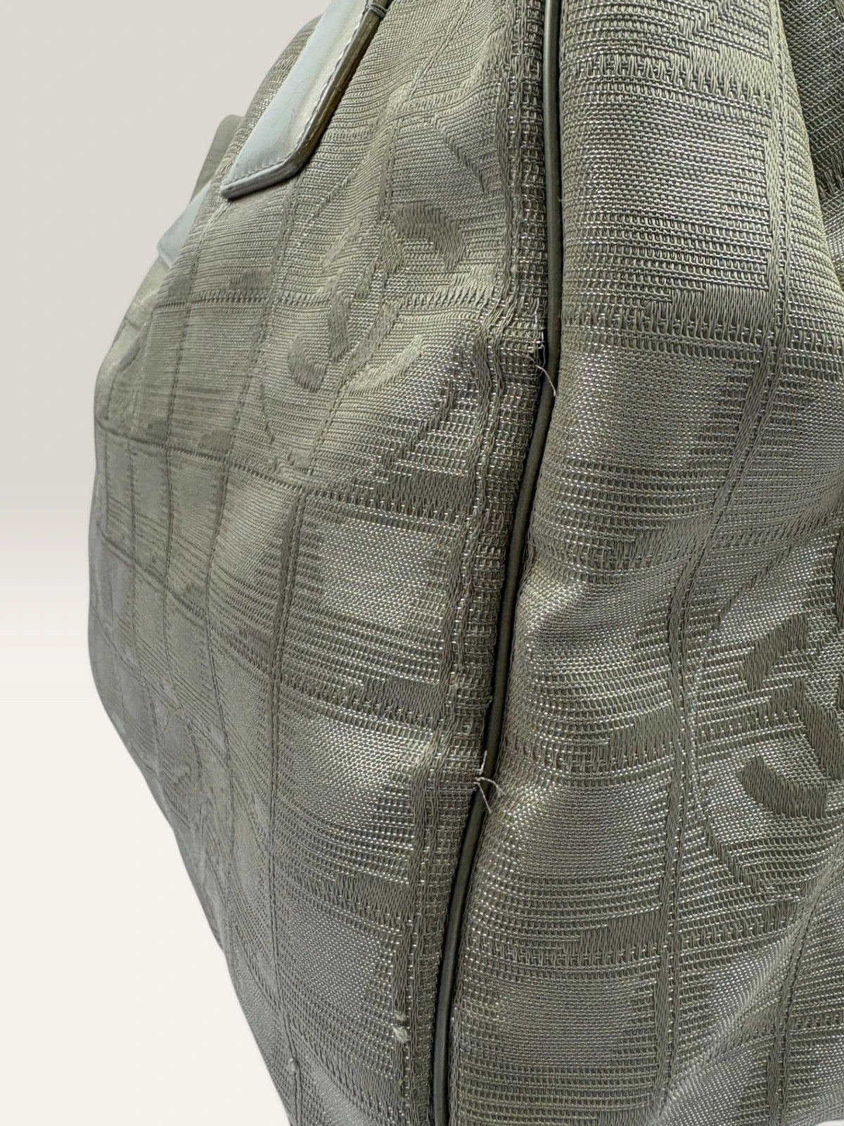 Chanel grey jacquard nylon tote with interlocking CC logo and leather shoulder straps.