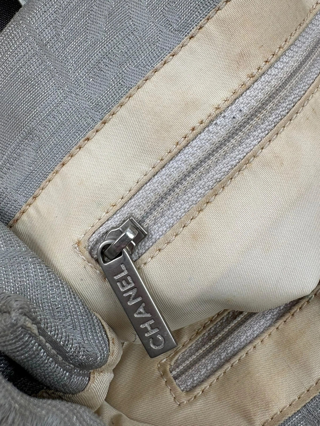 Chanel grey jacquard nylon tote with interlocking CC logo and leather shoulder straps.